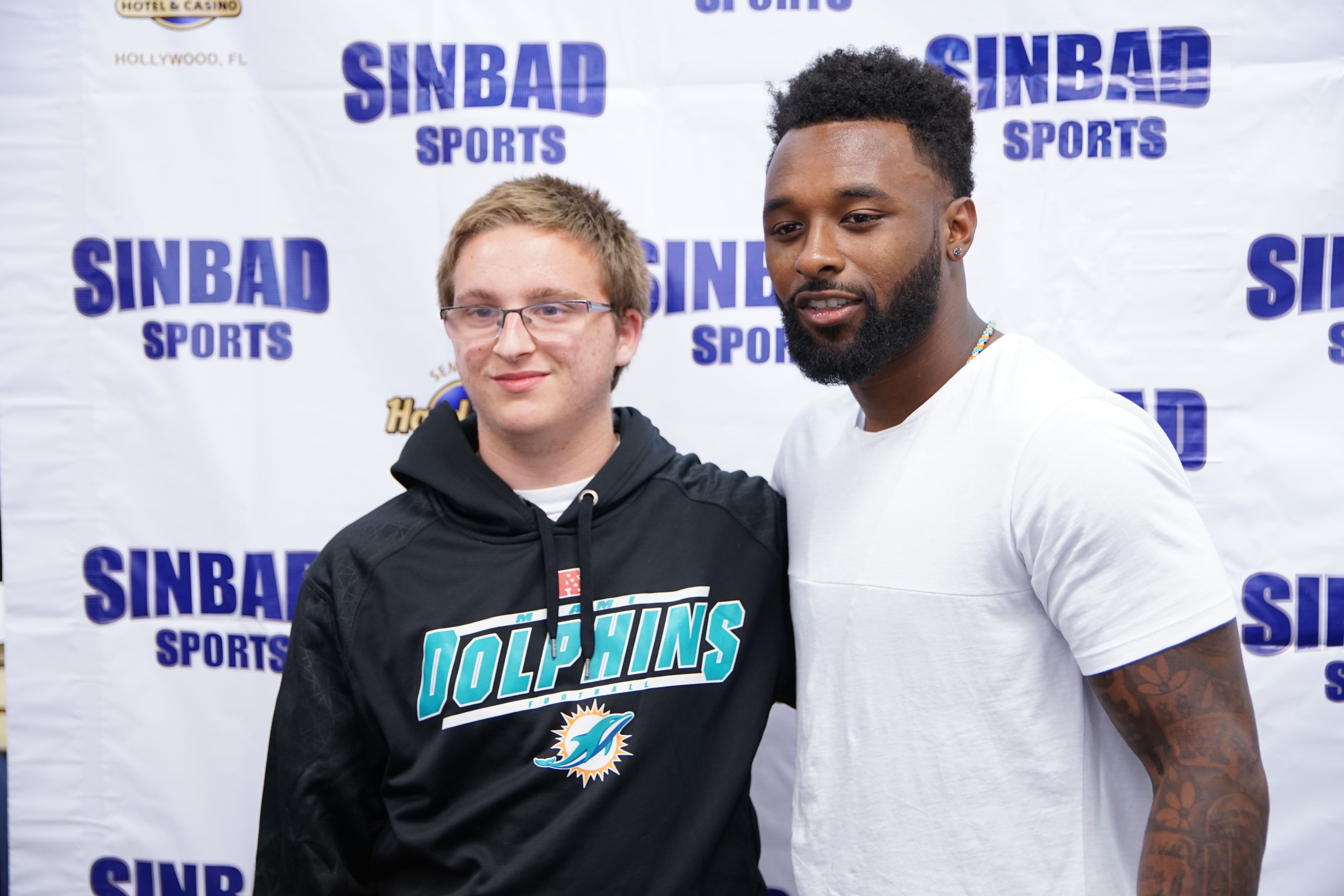 jarvis landry with a fan at sinbad sports