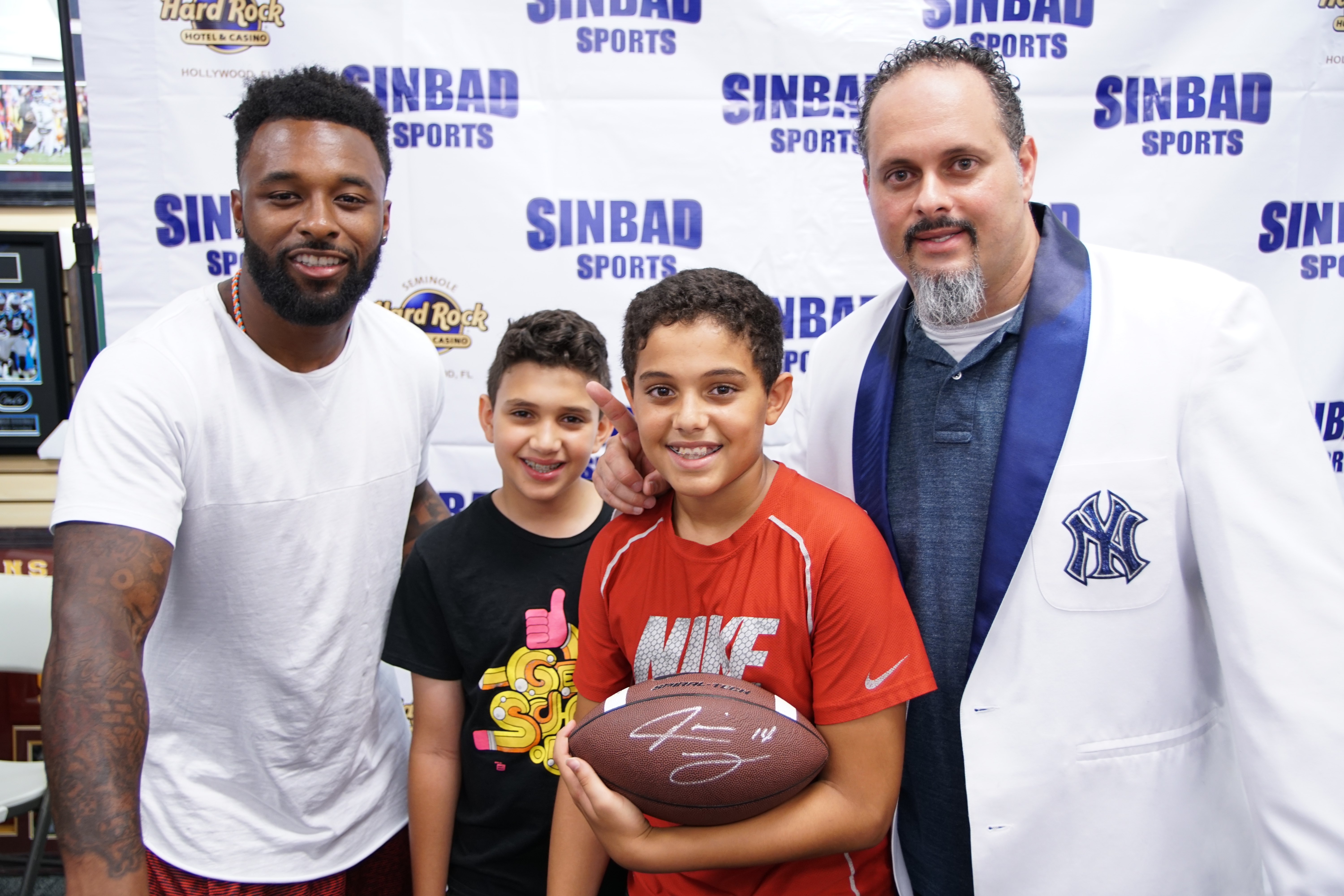 jarvis landry with sinbad family at autograph event in Miami